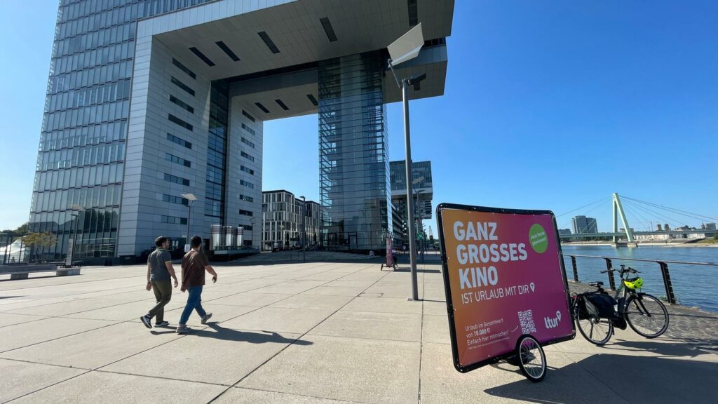 Bike advertising in Cologne in front of the crane buildings